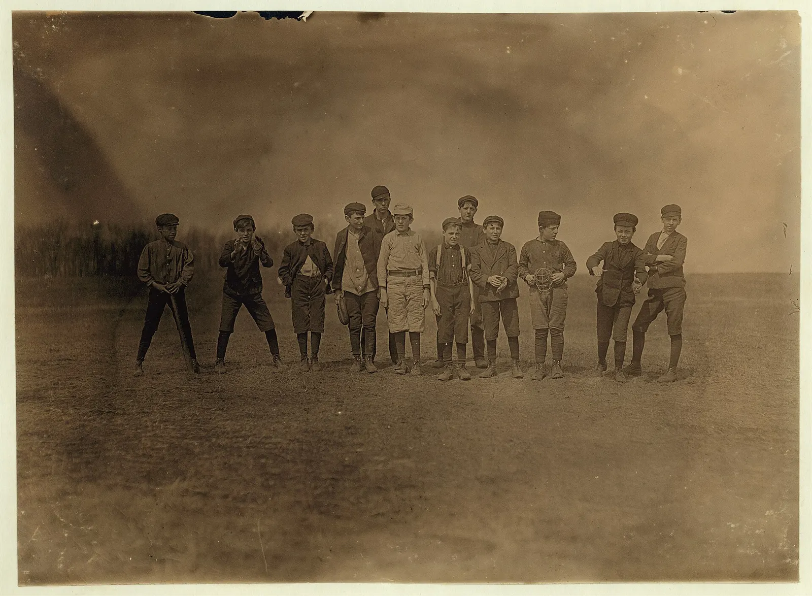 A boys' baseball team from the Natick Mills, Rhode Island, photographed by Lewis Hine on a Saturday afternoon in April 1909