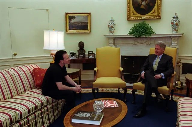 Bono and the members of U2 meeting President Bill Clinton in the Oval Office in March 1999