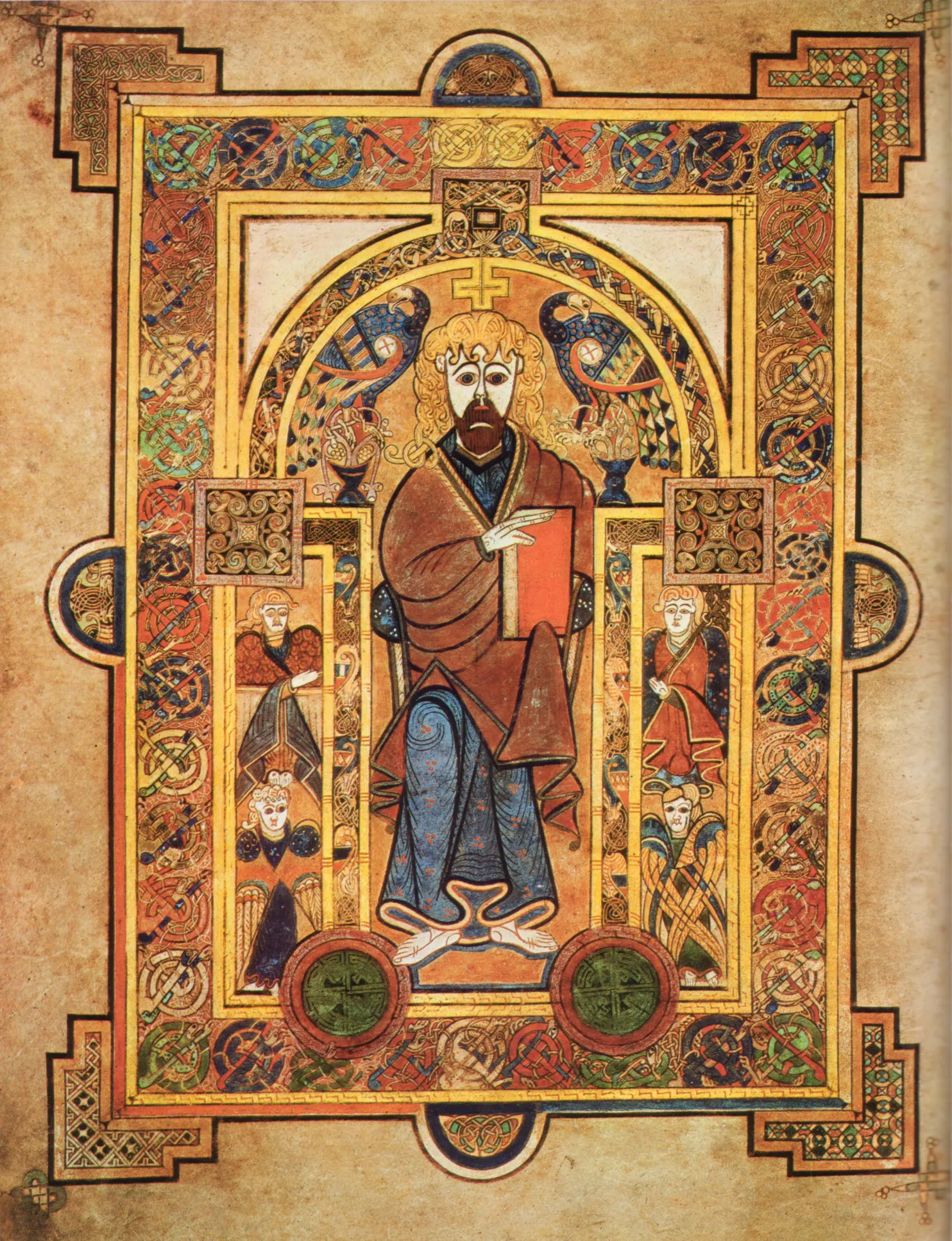 Folio 32v of the Book of Kells showing Christ enthroned, flanked by two peacocks amid interlaced Celtic ornament