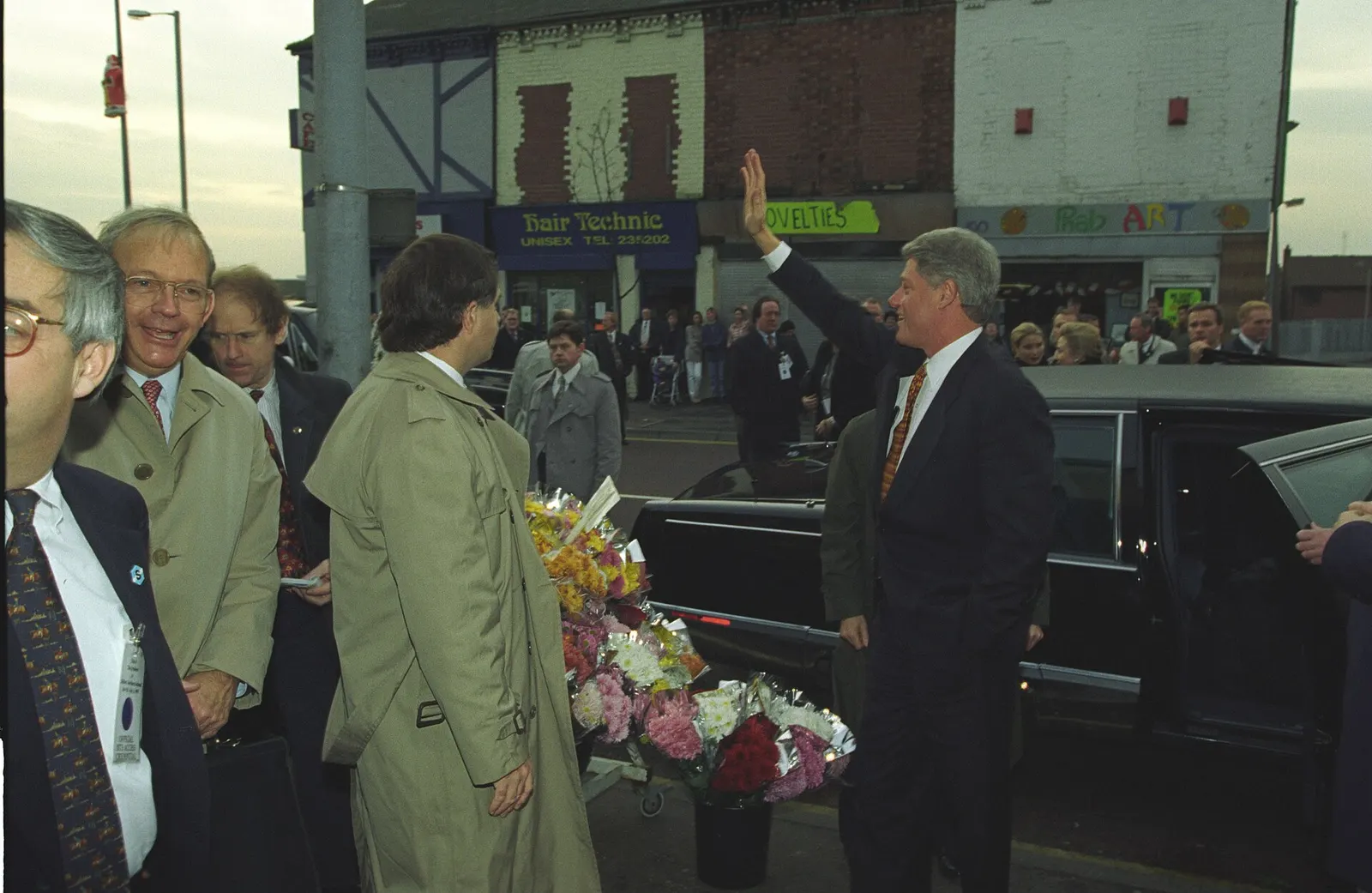 President Bill Clinton waving to crowds in the Shankill district of Belfast during his visit on 30 November 1995