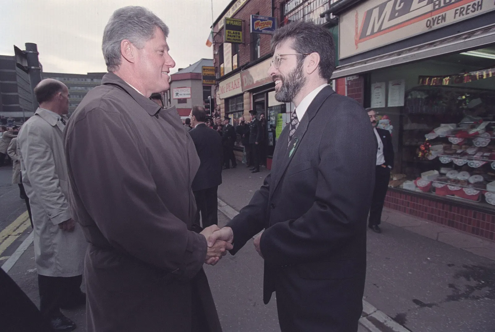 President Bill Clinton greets Gerry Adams on the Falls Road in West Belfast
