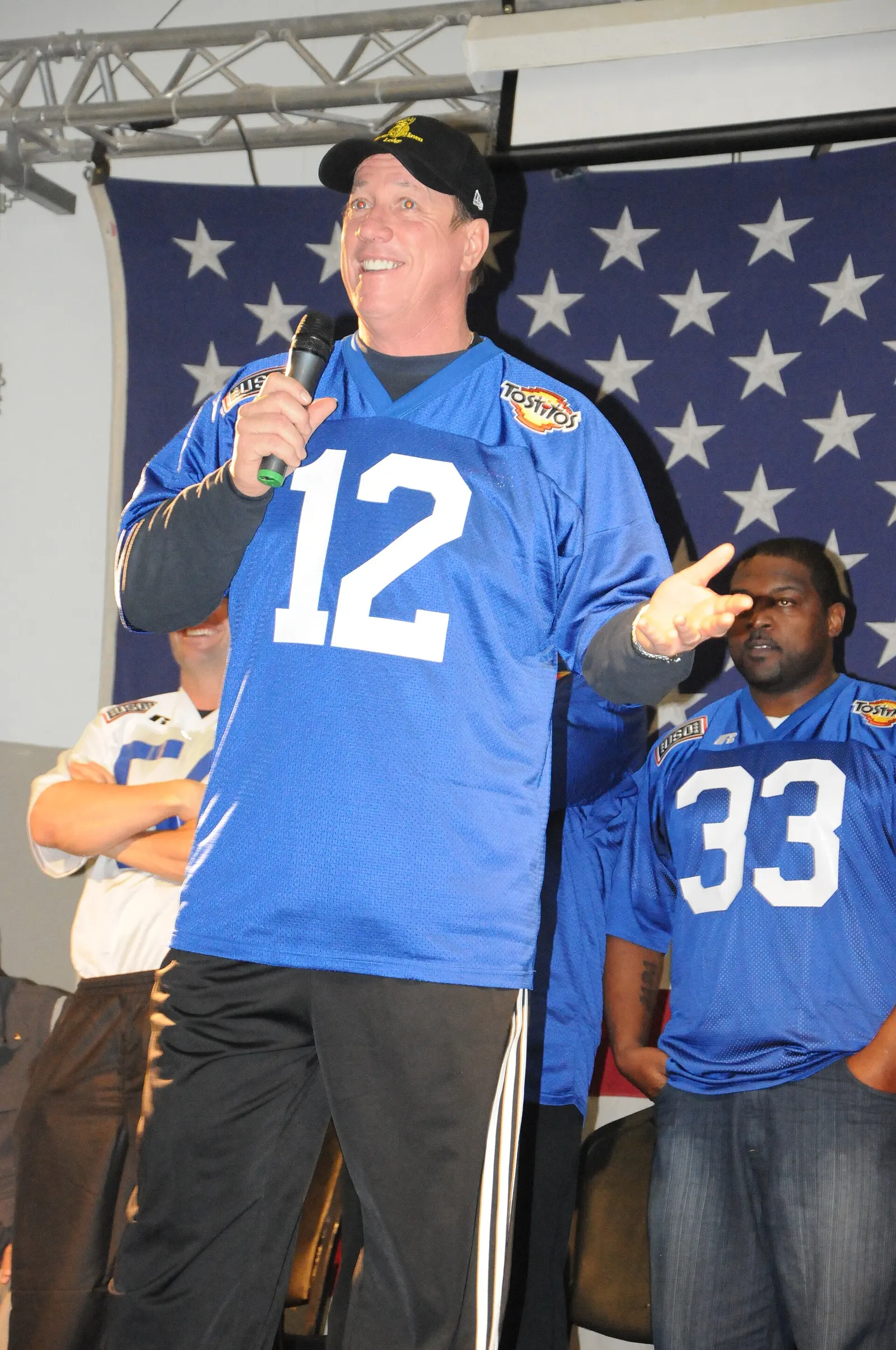 Former Buffalo Bills quarterback Jim Kelly speaking to troops at a pep rally at Joint Base Balad, Iraq