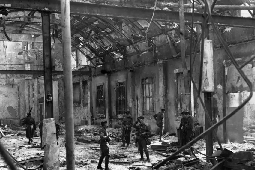 Ruins of the General Post Office in Dublin after the Easter Rising of April 1916, with British soldiers in the street