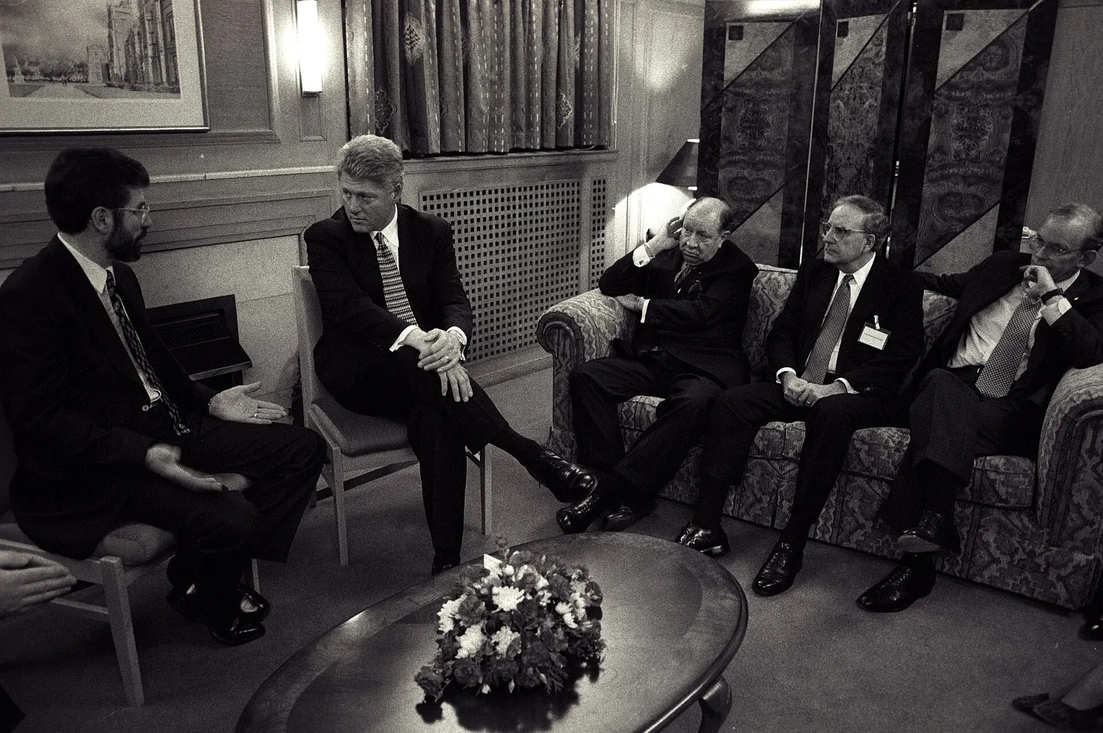 President Bill Clinton meeting Gerry Adams at Queen's University Belfast on November 30, 1995, with George Mitchell present